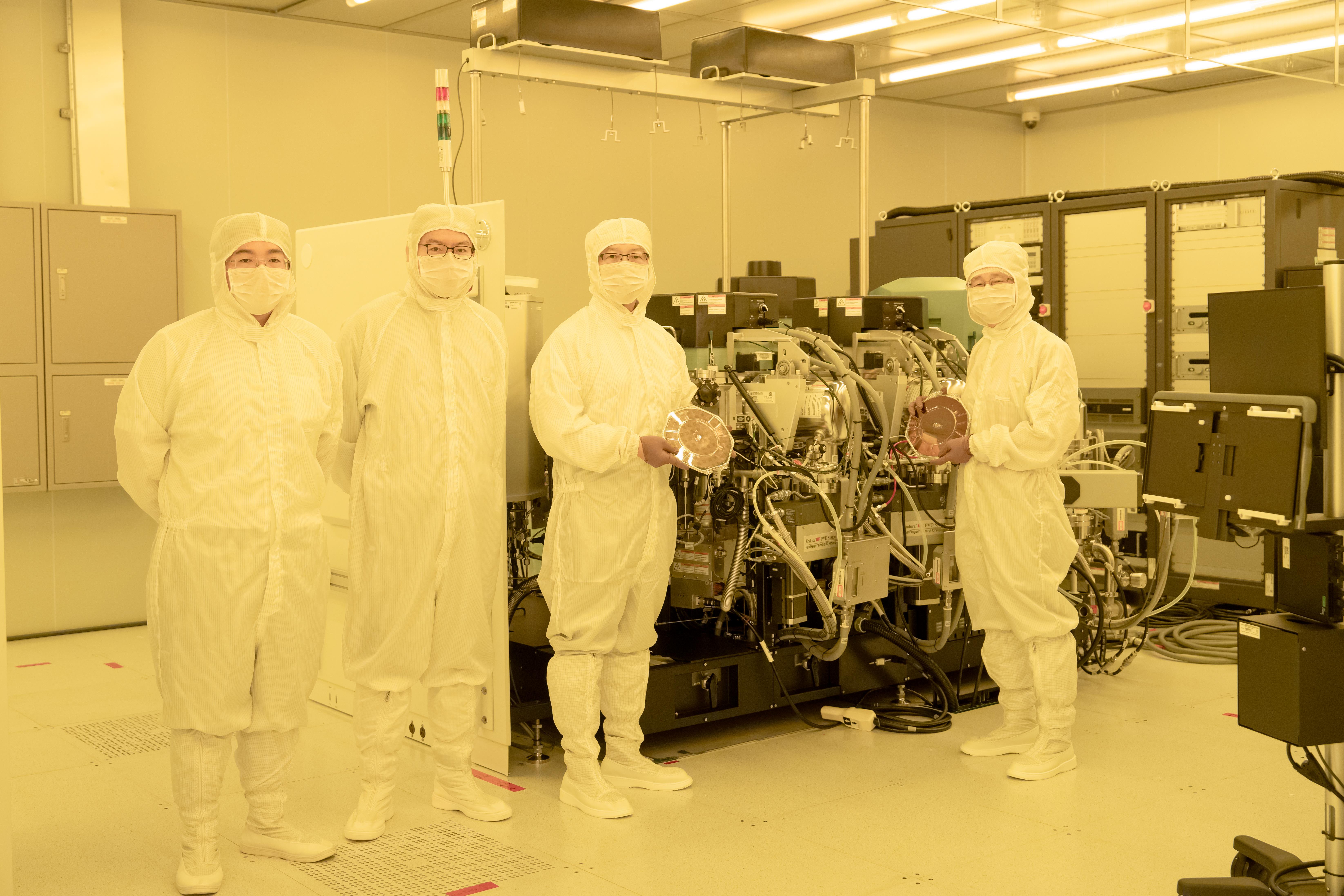 Distinguished Research Fellow Chii-Dong Chen, President James C. Liao,Assistant Research Fellow Chung-Ting Ke, and Assistant Research Scientist Yen-Chun Chen(from right to left) inside the cleanroom.Photo credit Academia Sinica